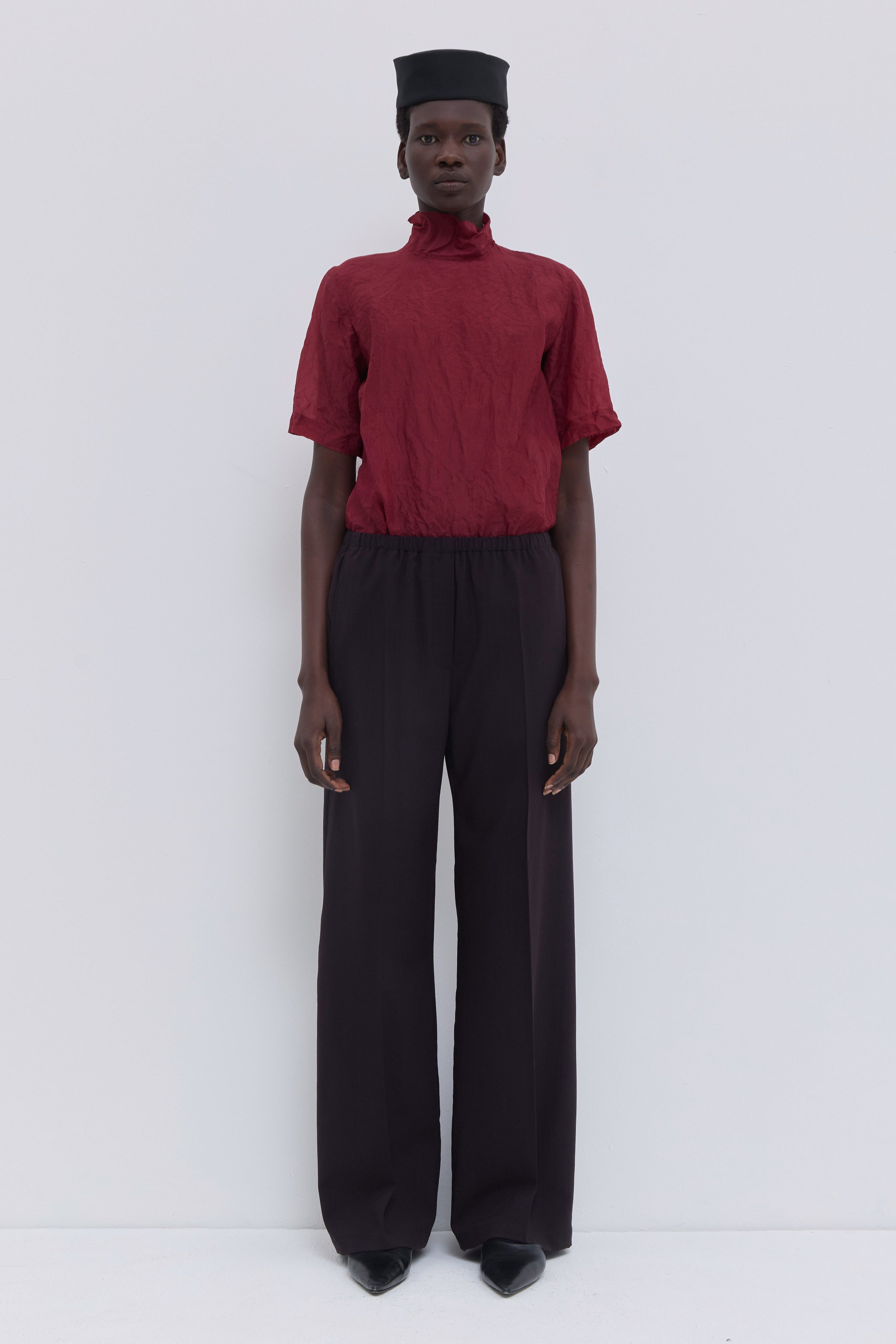 Deep plum low-waist trousers with wide-leg silhouette and elastic waistband
