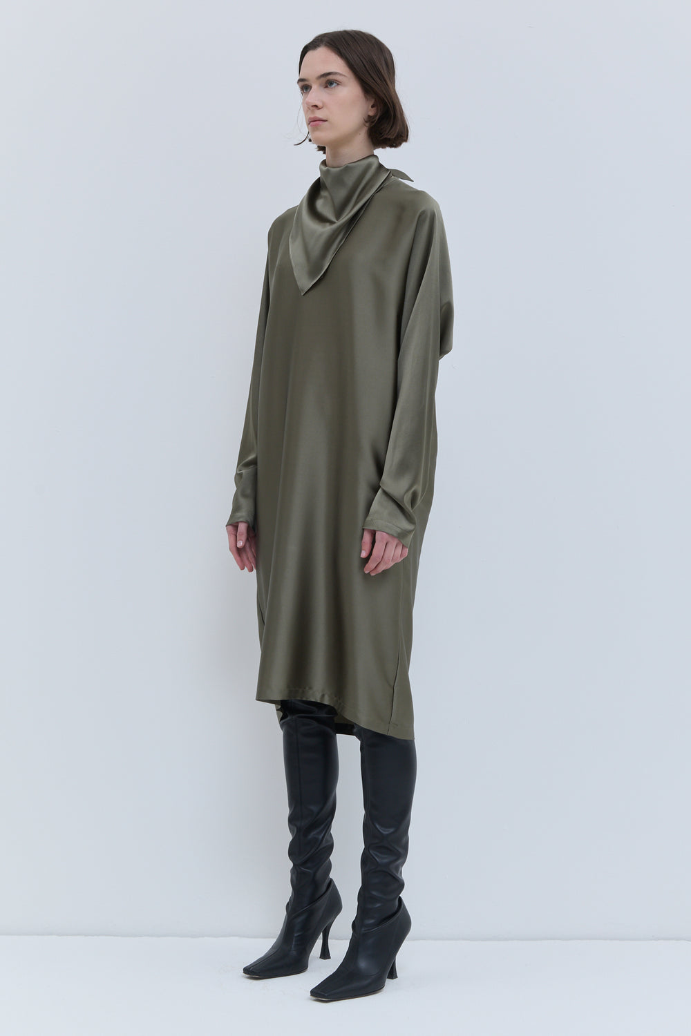 Front view of the artichoke Deira dress with relaxed silhouette and long batwing sleeves.