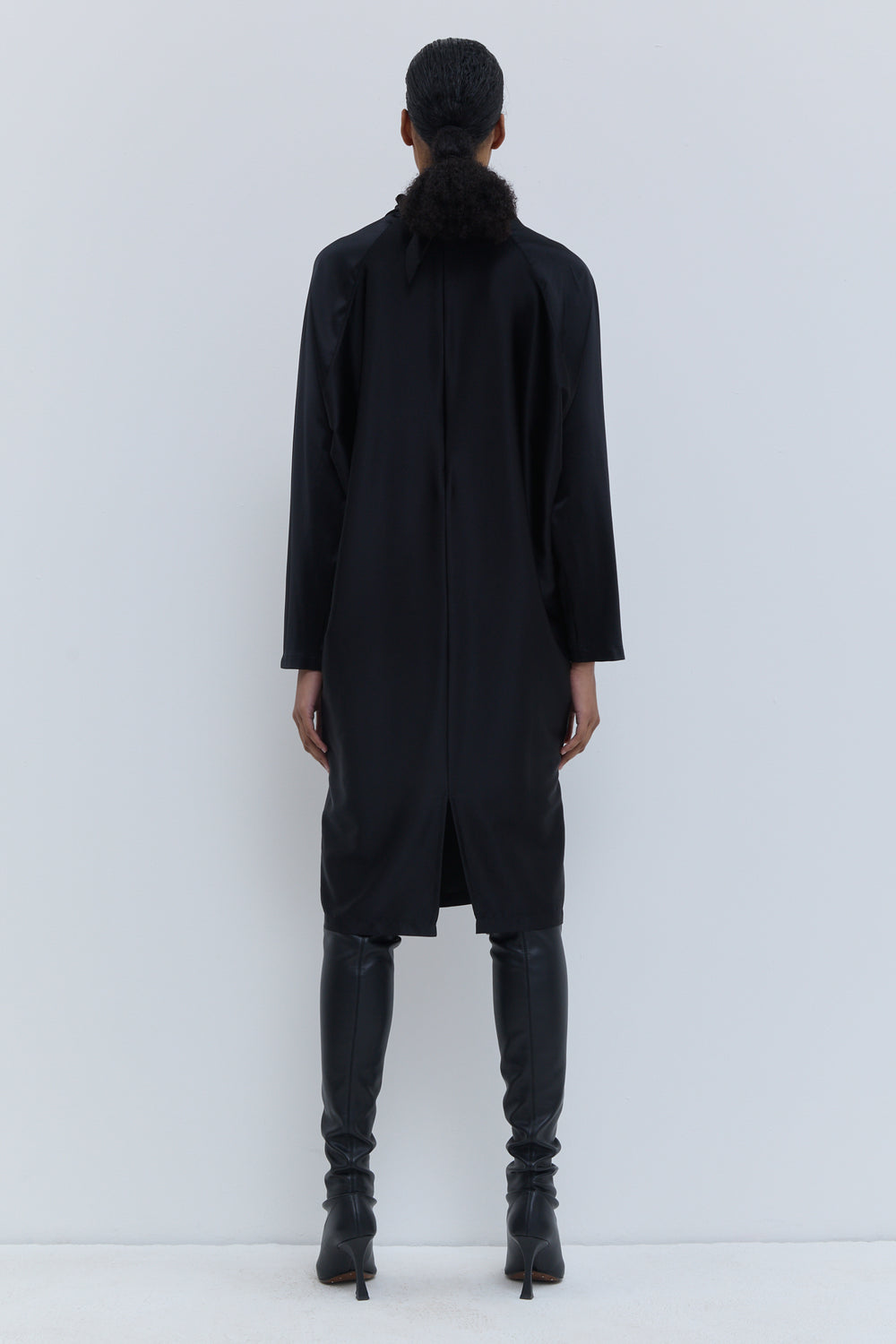 Back view of Christian Wijnants Deira black dress with long sleeves and straight silhouette