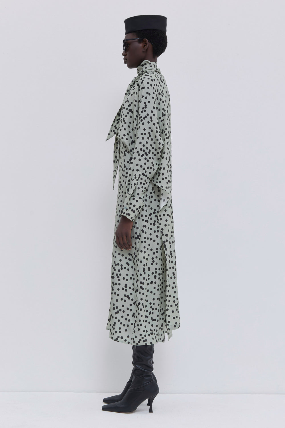 Sage polka dot satin dress with layered front panel, scarf collar and relaxed batwing sleeves by Christian Wijnants.