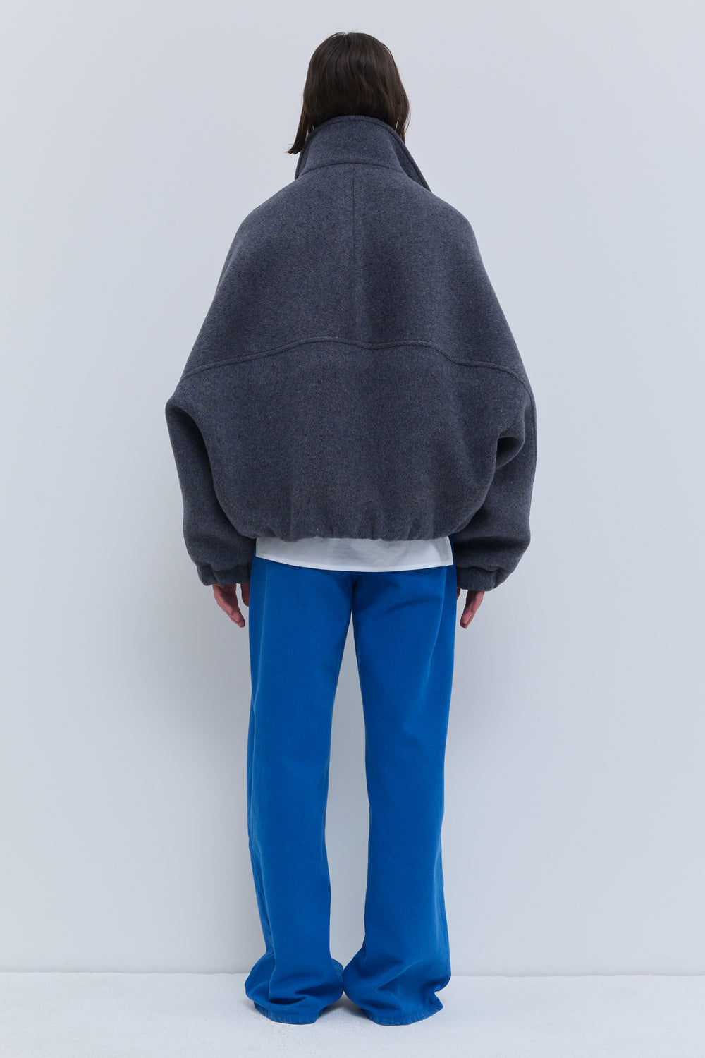 Christian Wijnants wool bomber jacket with high collar, front pockets and elasticated cuffs in Dust Blue