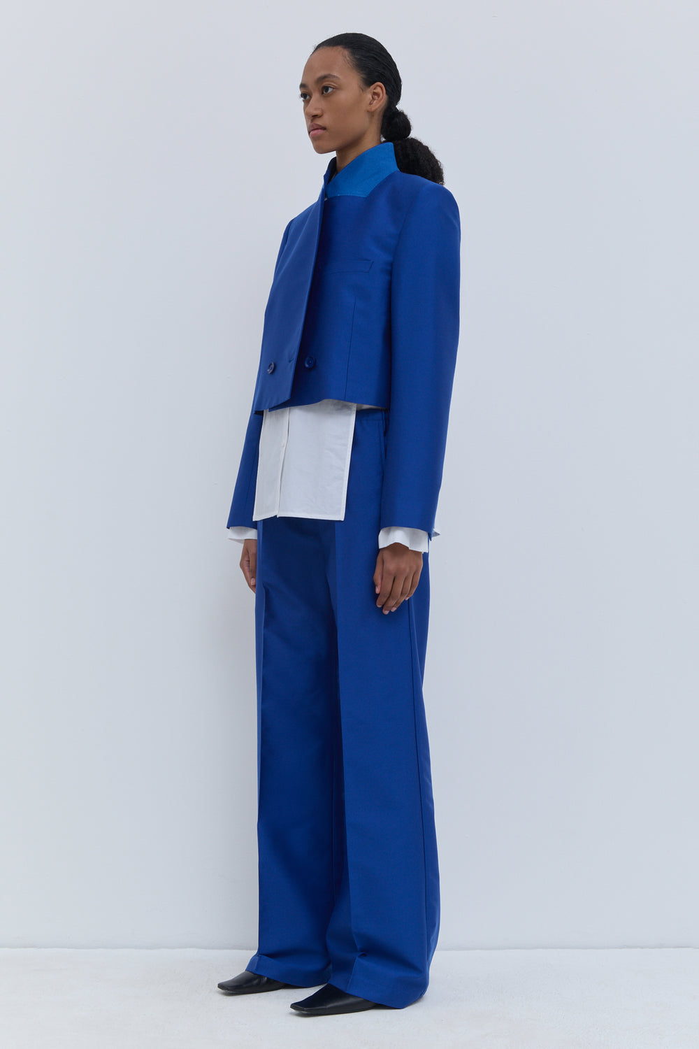 Deep blue tailored jacket with standing collar