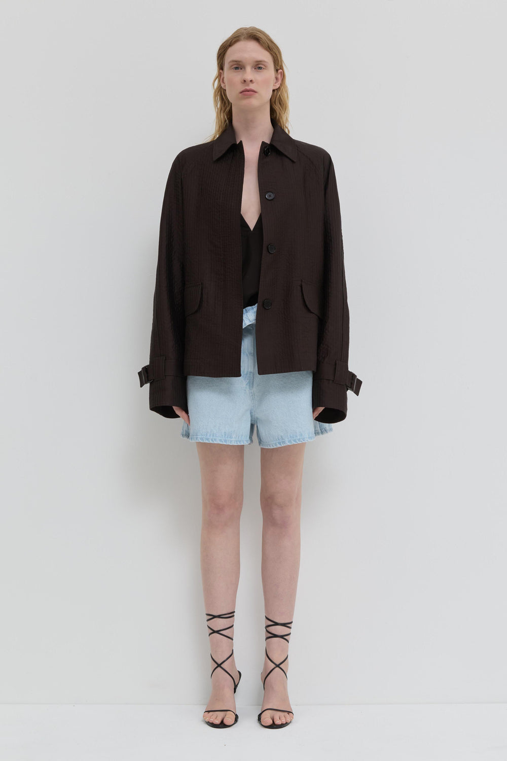 Chocolate quilted jacket with belted cuffs and relaxed fit