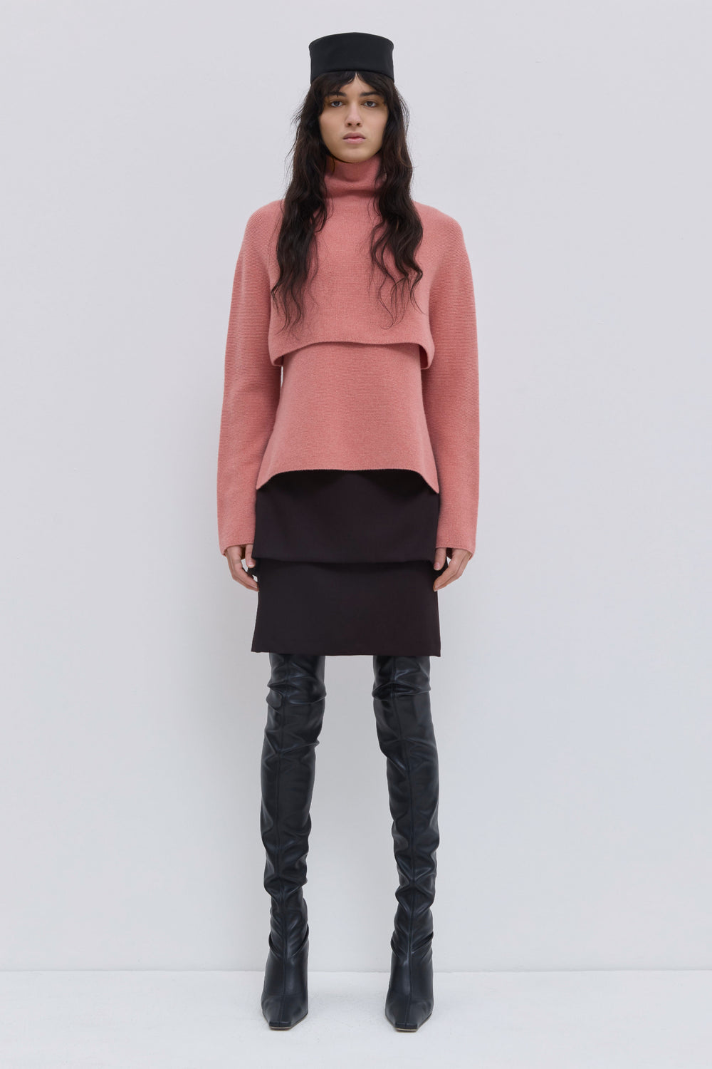 Coral cropped turtleneck sweater in super fine wool layered over matching knit top