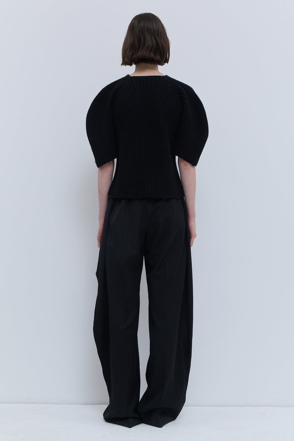 Kisha black knitwear top with rounded sleeves