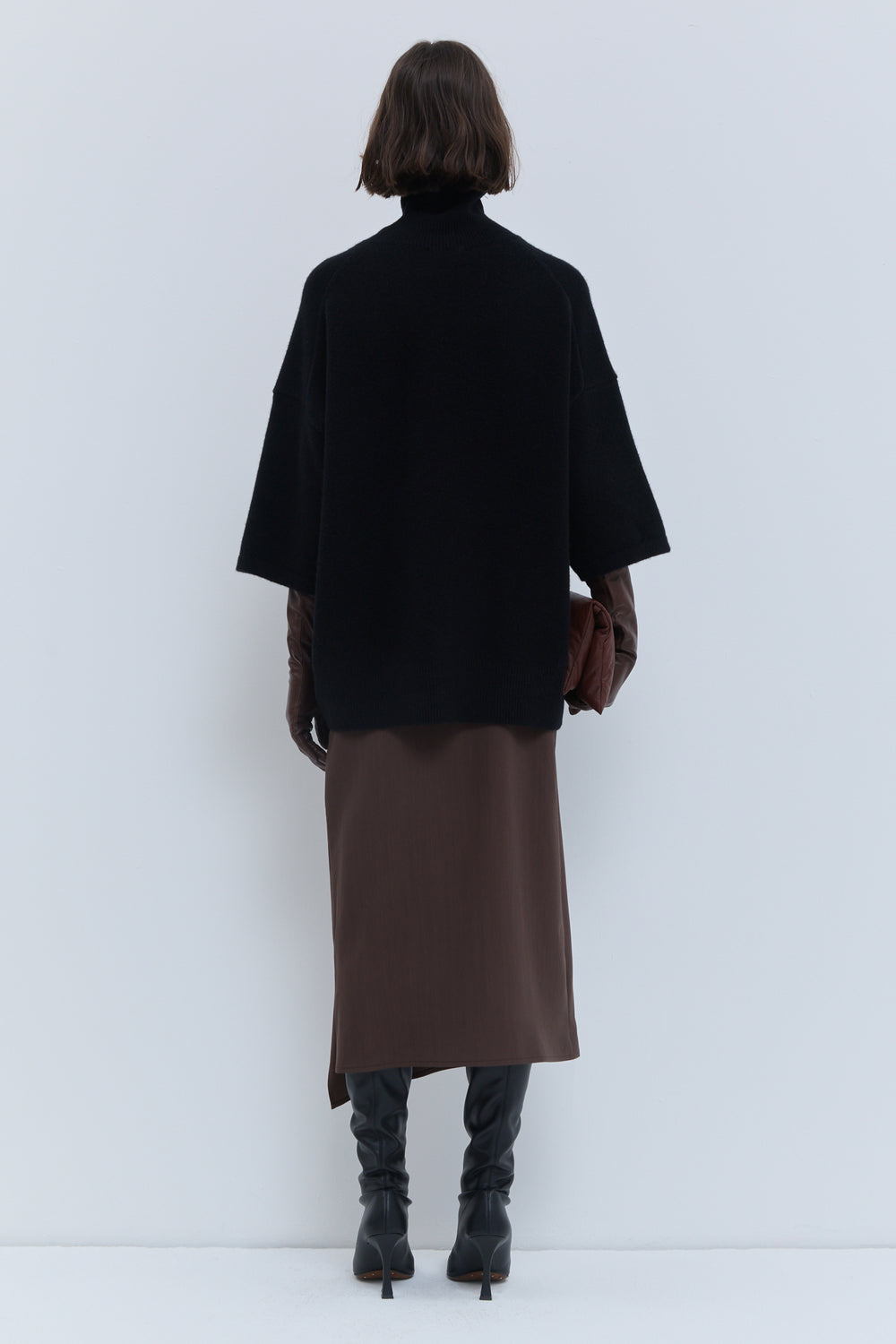 Black luxury knit top with relaxed oversized silhouette