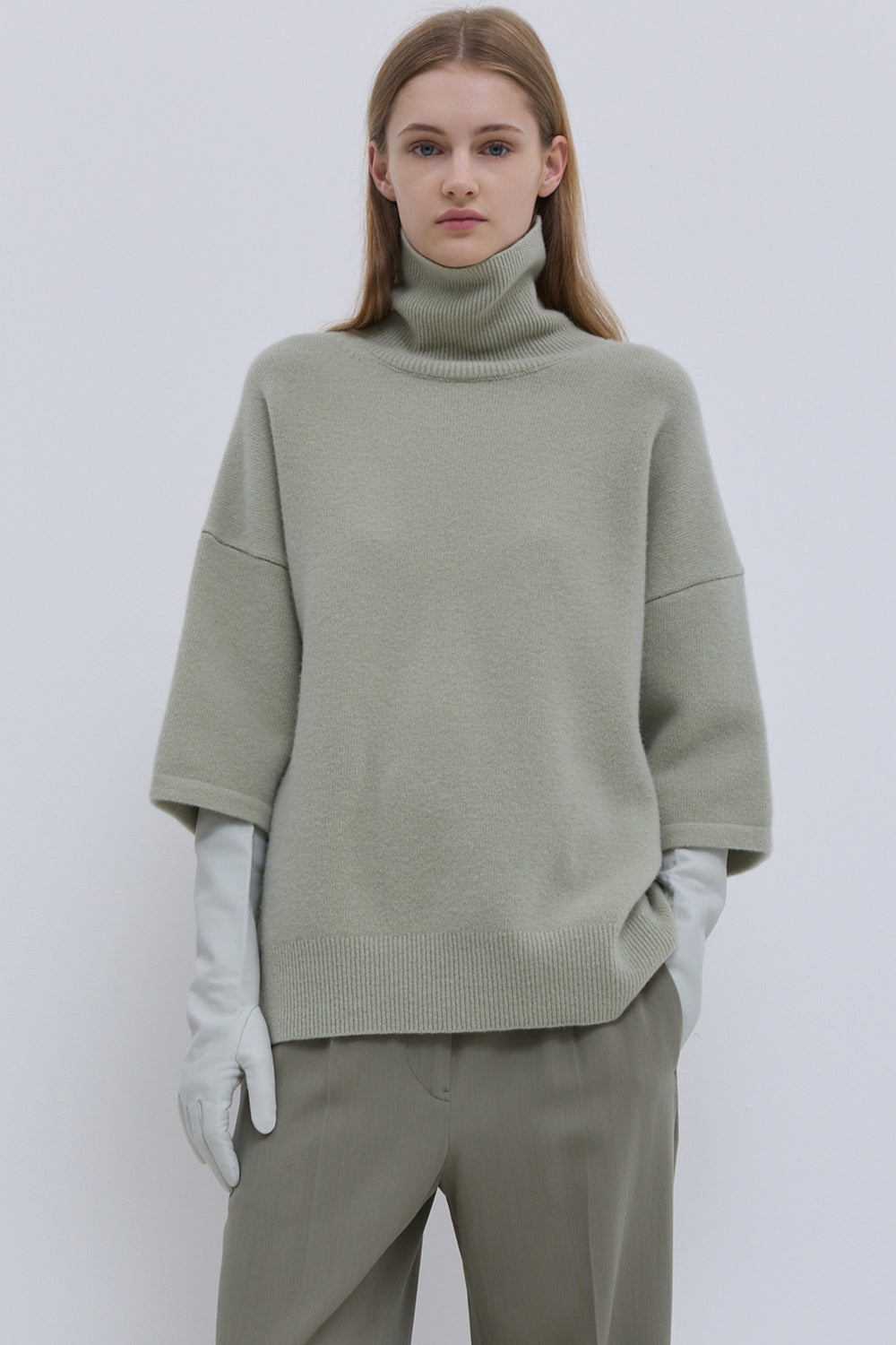 Light sage oversized knit top with high turtleneck