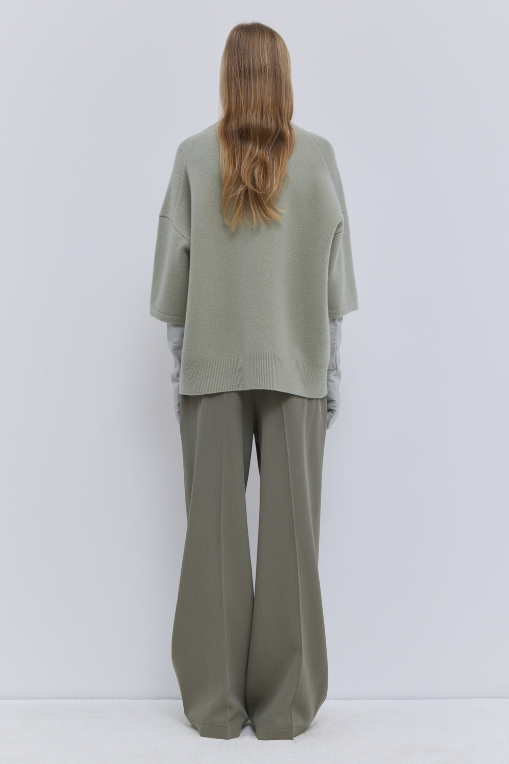 Light sage luxury knit top with relaxed oversized silhouette