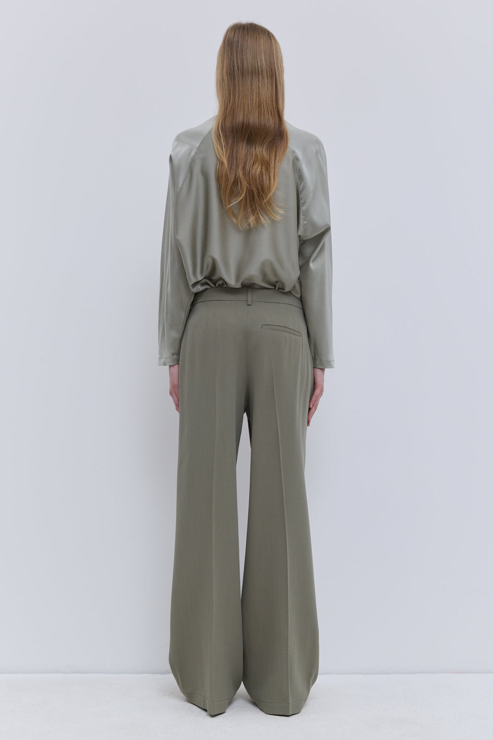 Christian Wijnants Laurel Cloud straight-leg wool trousers with refined fluid silhouette, back view