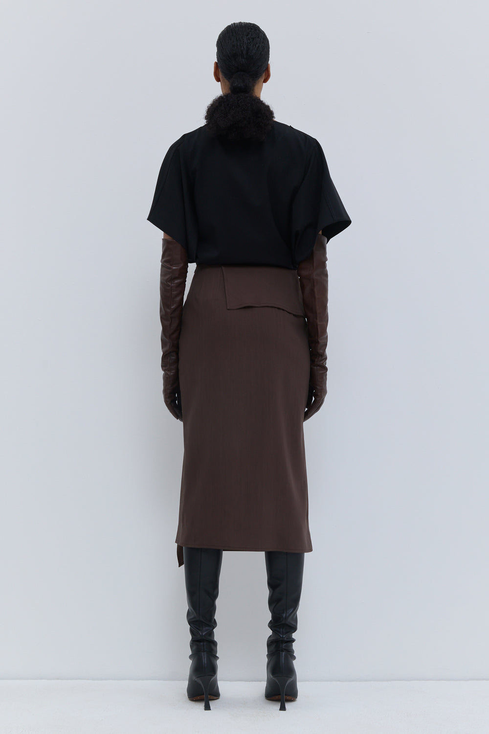 Christian Wijnants Sailo chestnut midi skirt with asymmetric front detail, side view.