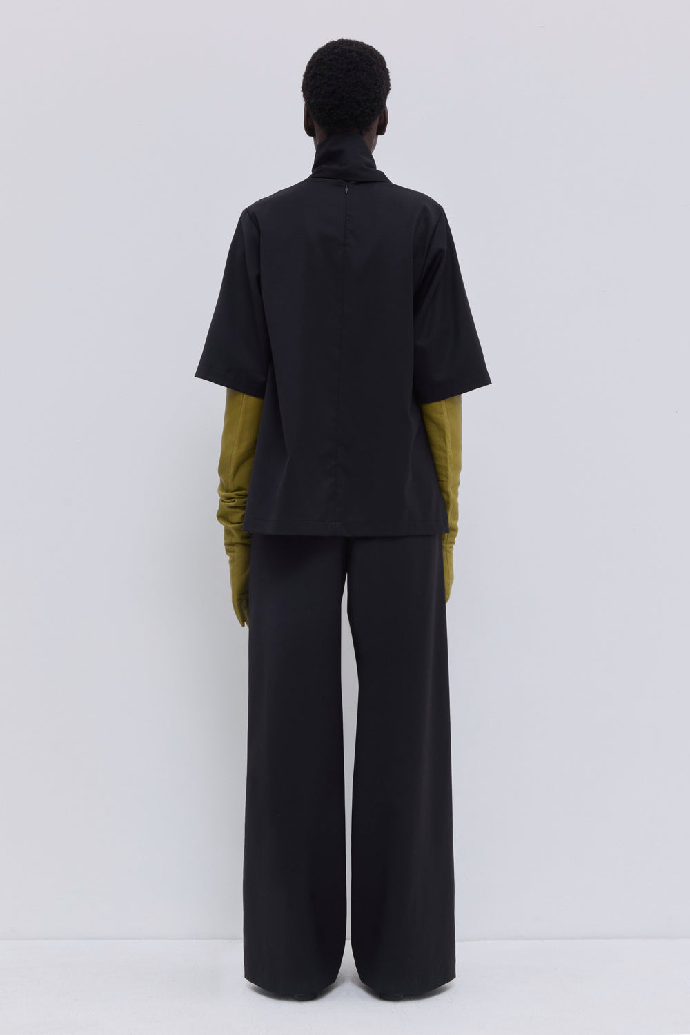 Italian wool top with open sides and relaxed fit