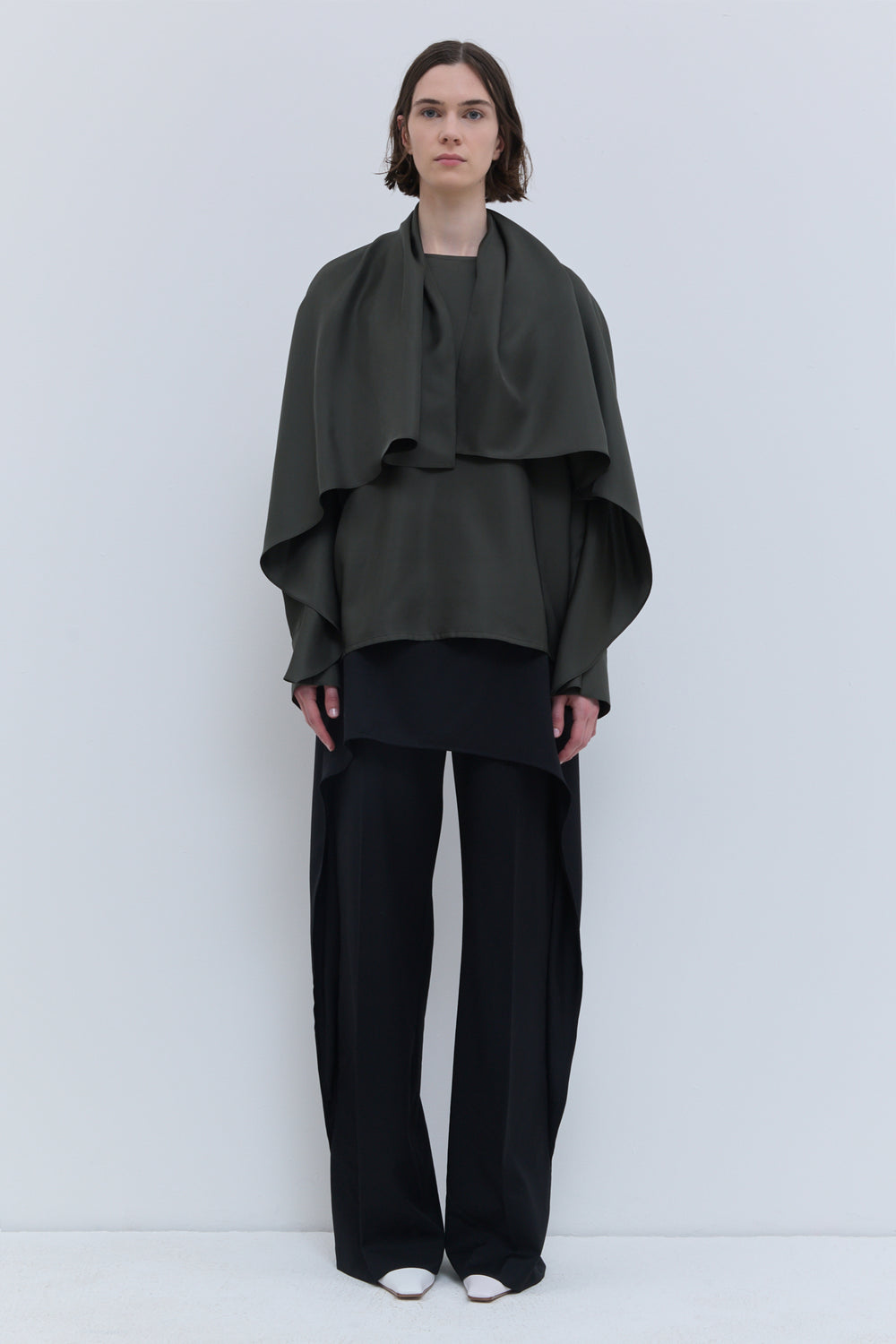 Thyme green silk batwing top with flowing integrated scarf worn loosely over the back