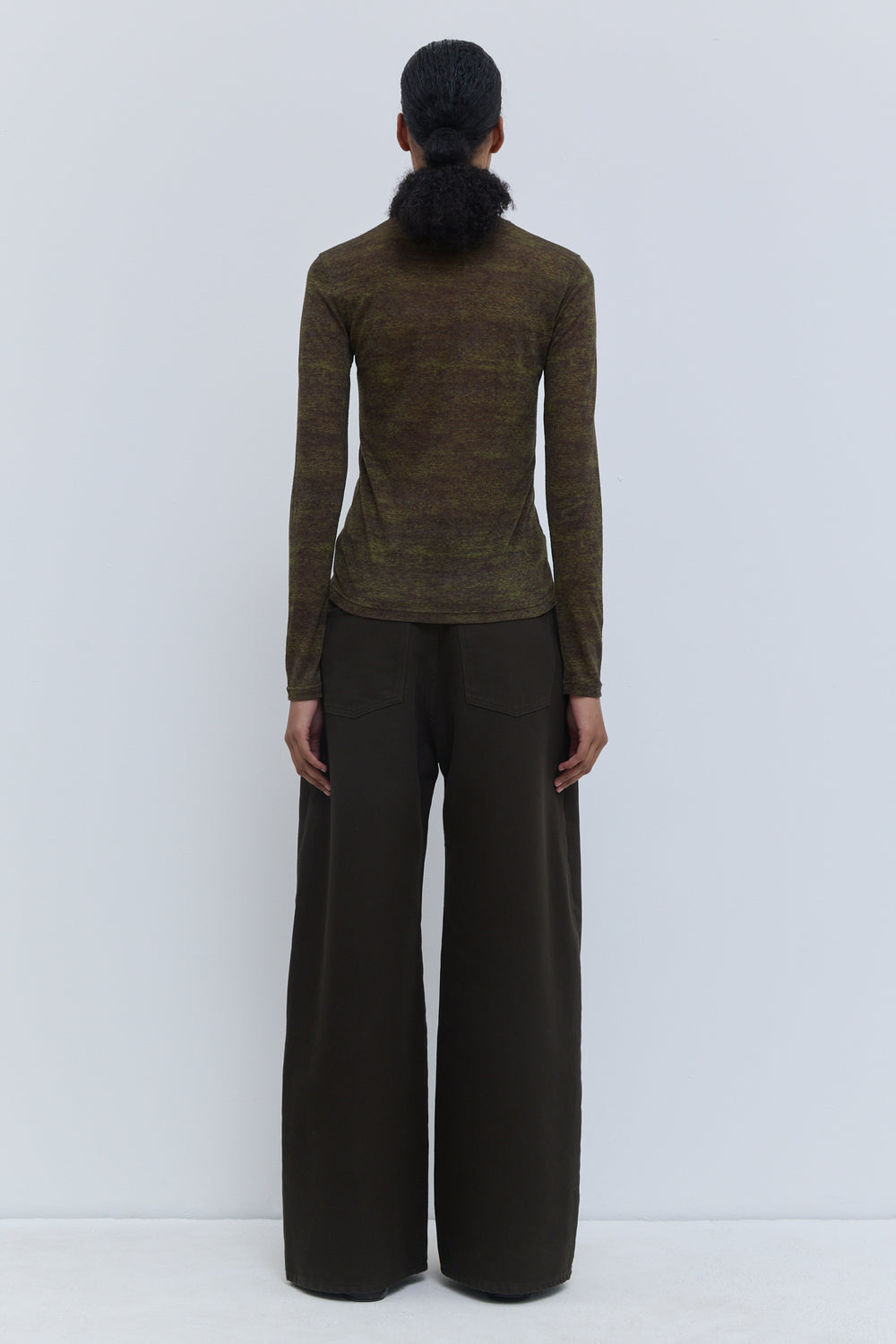 Back view of Christian Wijnants Tugal turtleneck top in stretch jersey with all over night forest storm print and fitted silhouette