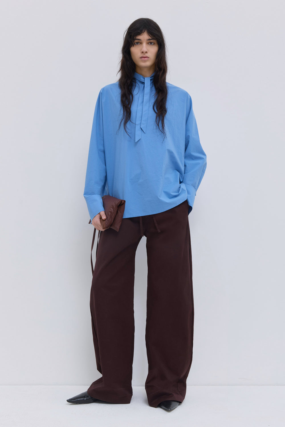Tuvra batwing sleeve top in cerulean organic cotton with relaxed fit and front tie detail.